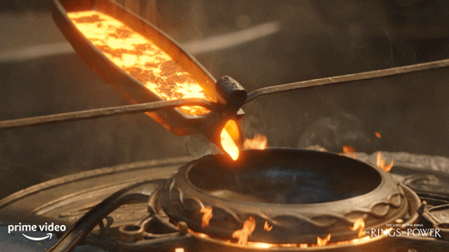 gif of molten metal being forged into a ring from lord of the ring: rings of power