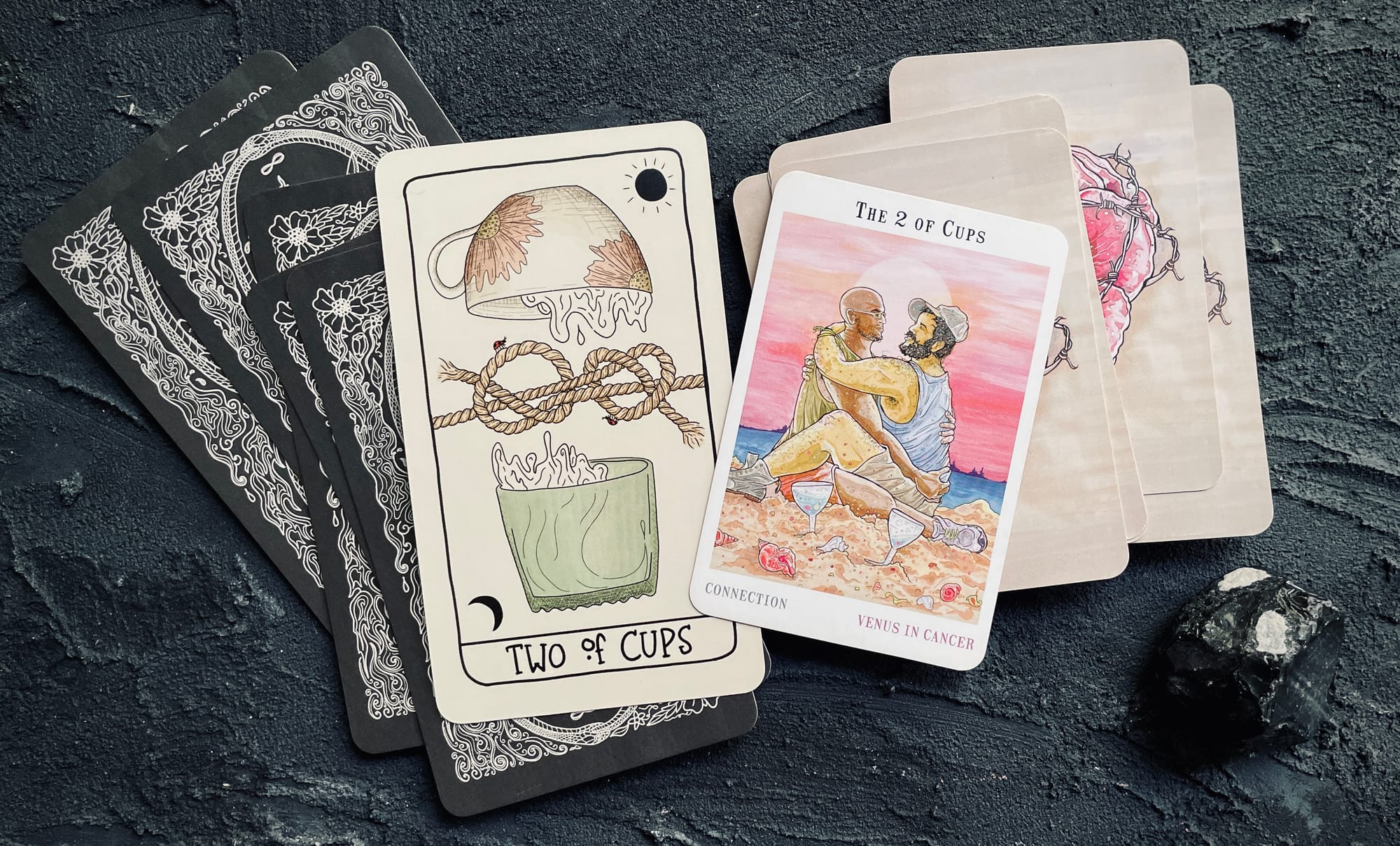 two of cups from the fifth spirit tarot (left) and the next world tarot (right)