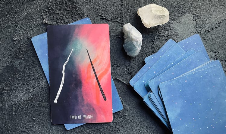 two of wands: the element of fire
